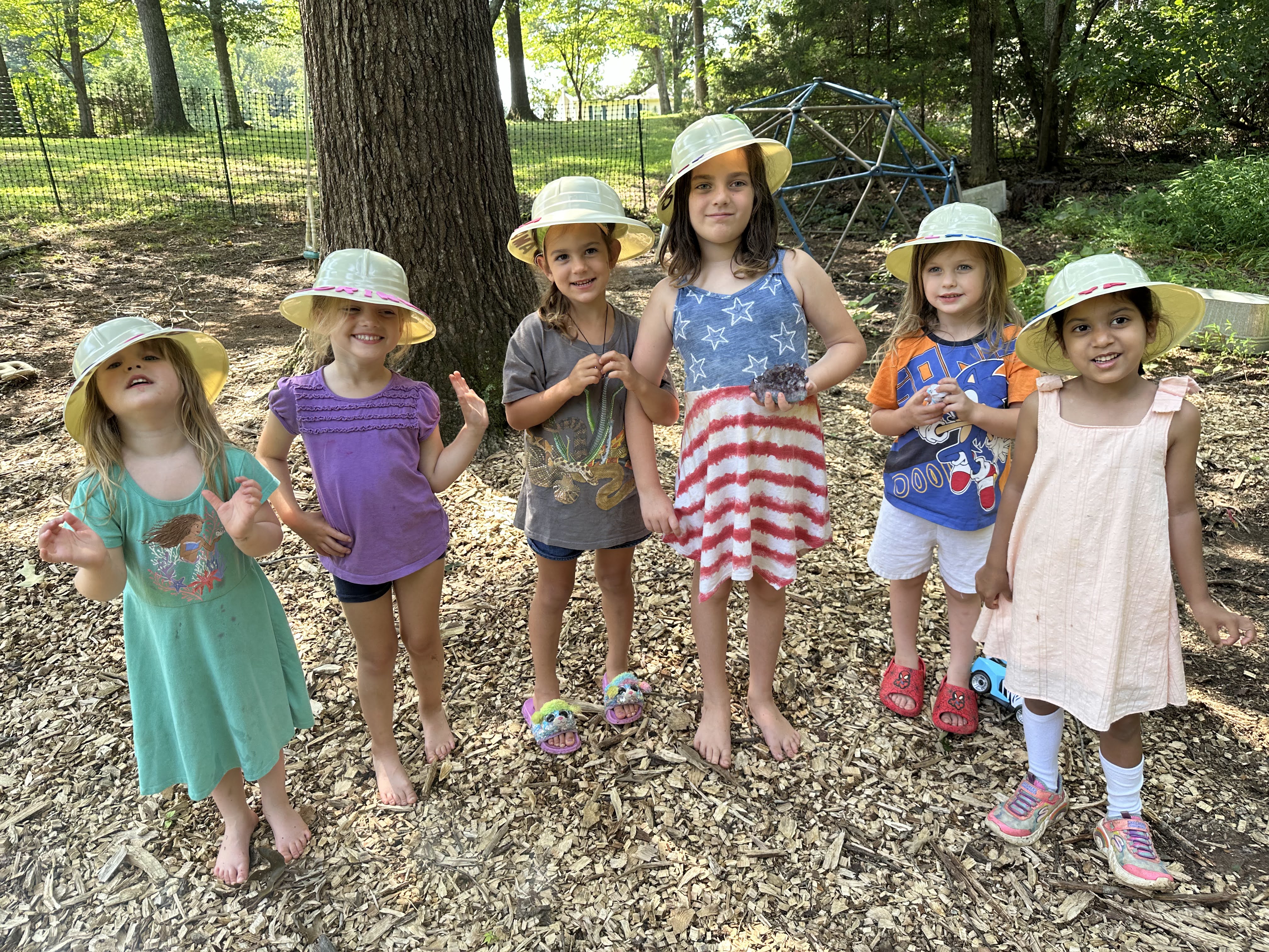 Wonder Den campers in sun hats
